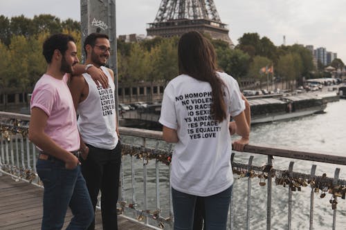 Free Group of Friends Together Near Eiffel Tower Stock Photo