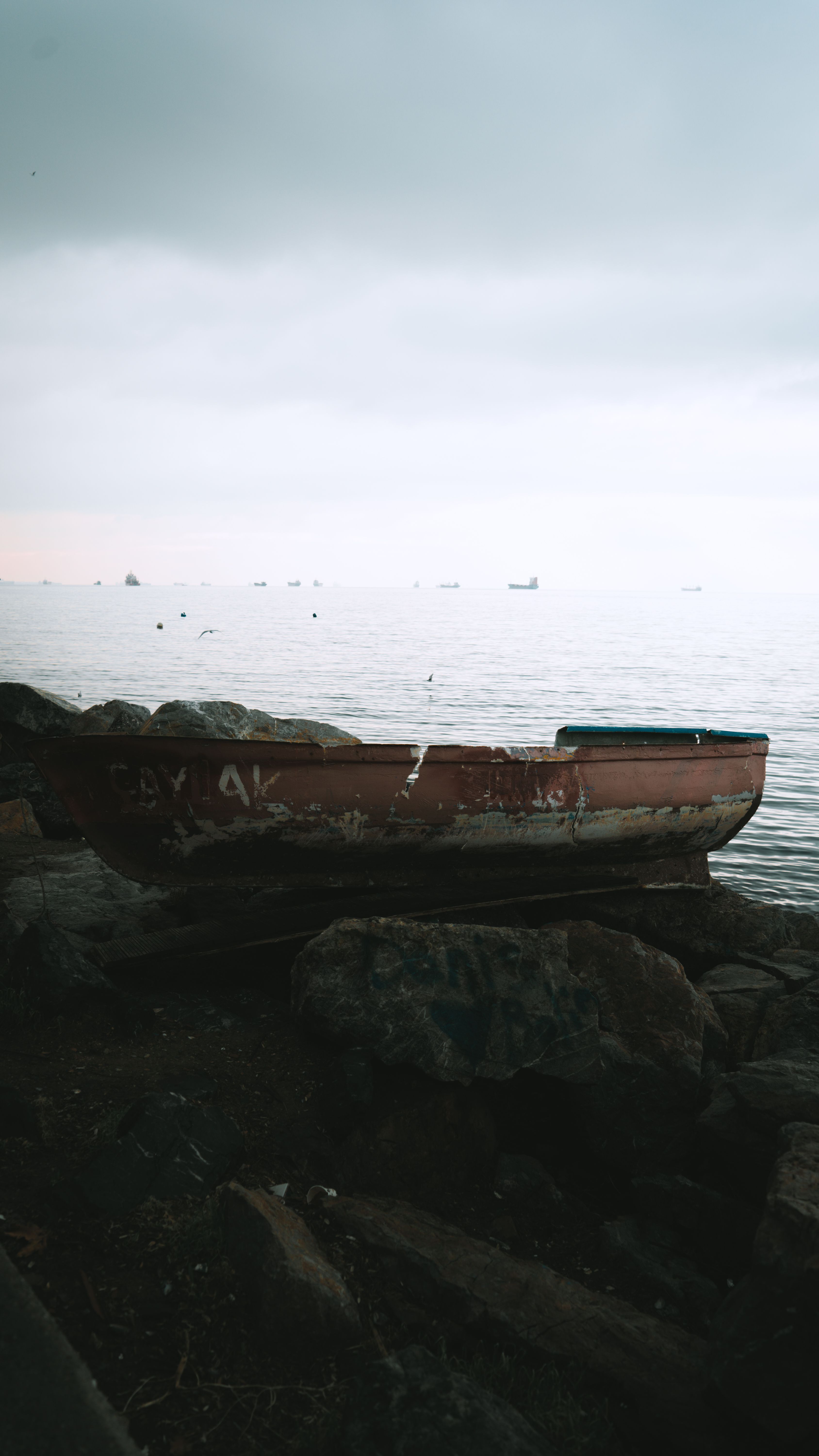 Boat on the Rocks by the Lake · Free Stock Photo