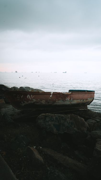 Boat on the Rocks by the Lake · Free Stock Photo