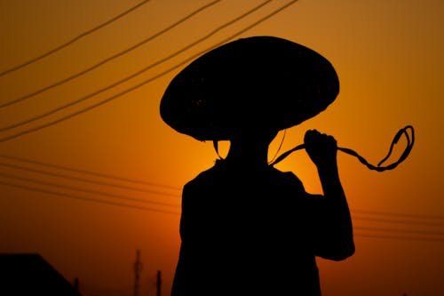 Silhouette of Man in Sombrero at Sunset