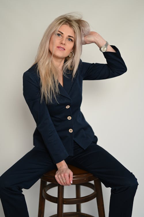 Blonde Woman Sitting on Chair