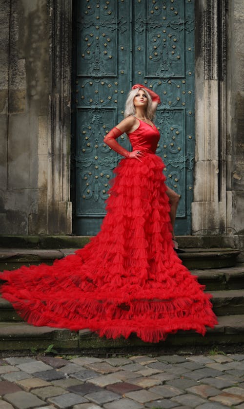 Blonde Woman in Red Dress on Stairs