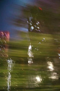 Abstract blurred cityscape photo capturing Kuala Lumpur's vibrant night lights.