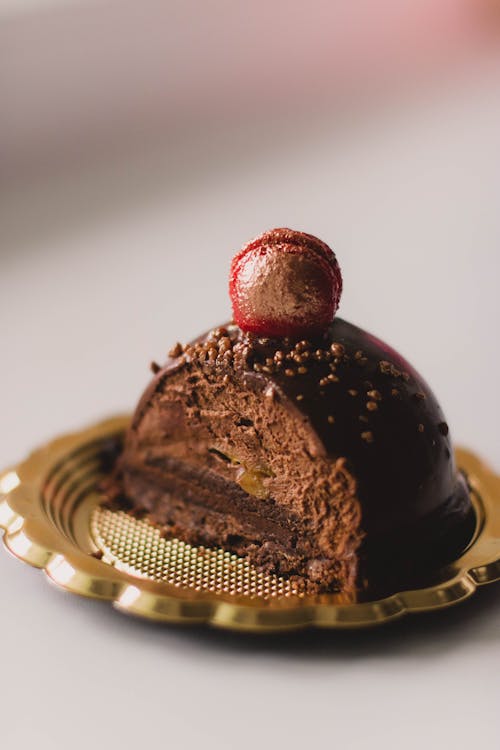 Free Sliced Chocolate Dessert on Golden Plate Stock Photo