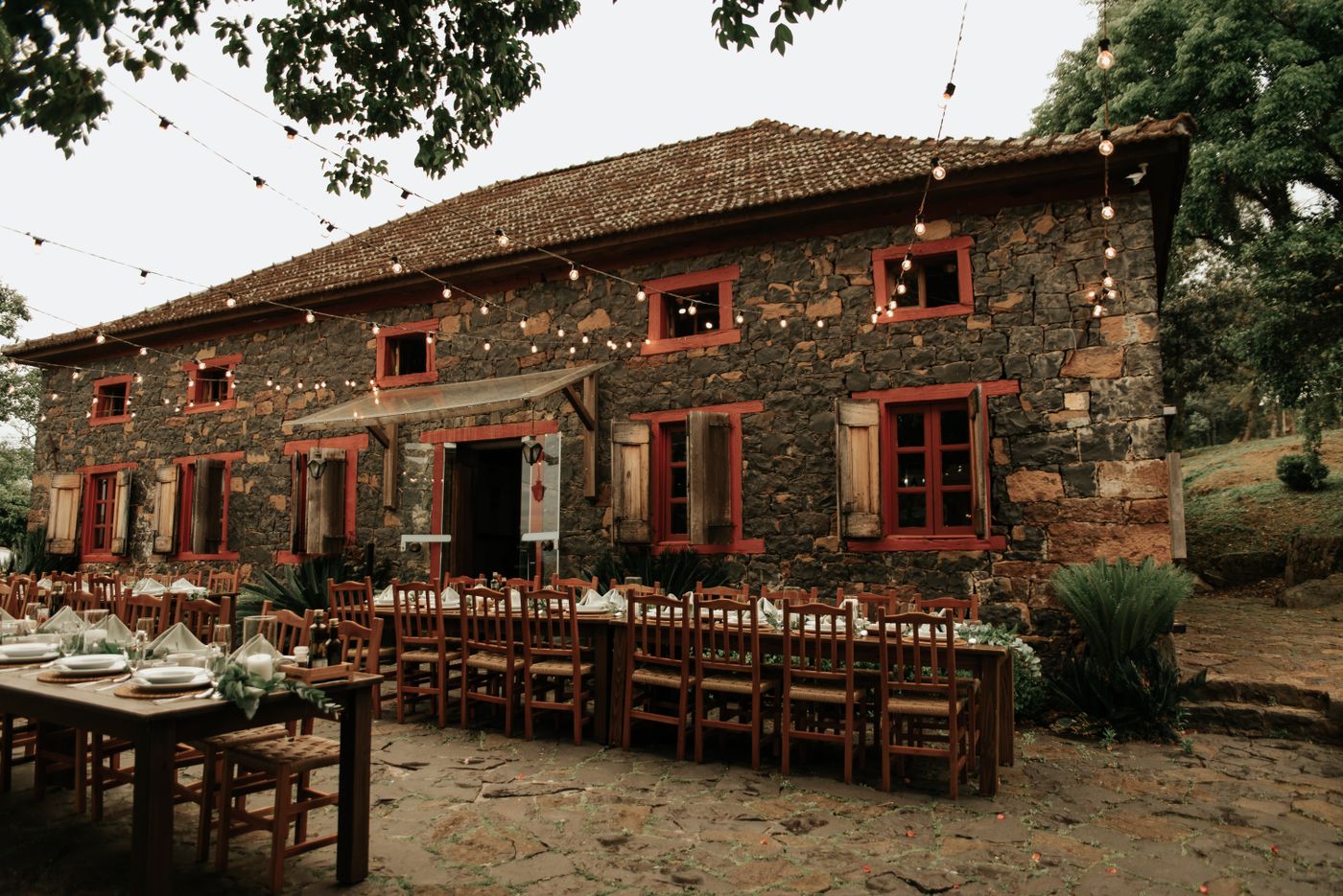 The stone barn and courtyard with long tables outside