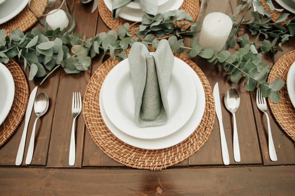 Plate, Plant and Silverware on Table