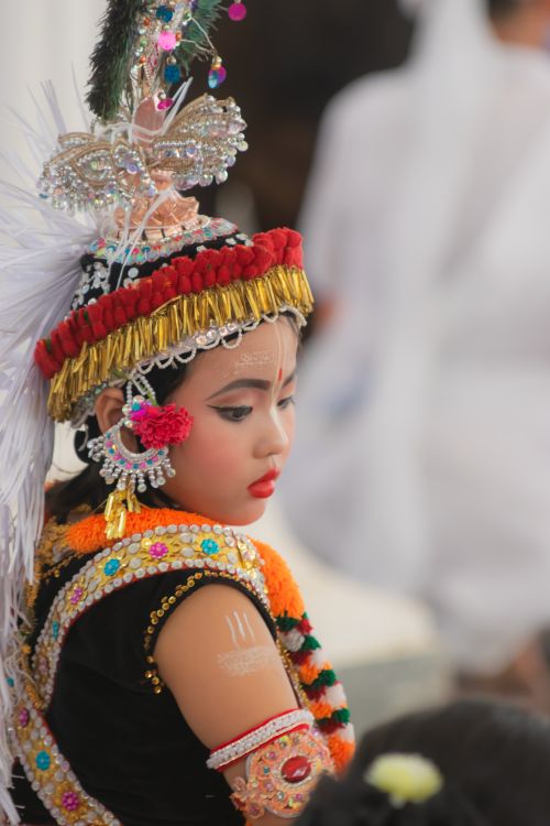 Free Portrait of a child in vibrant traditional Asian dress with intricate headwear and jewelry. Stock Photo