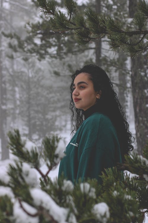 Brunette Woman in Forest in Winter