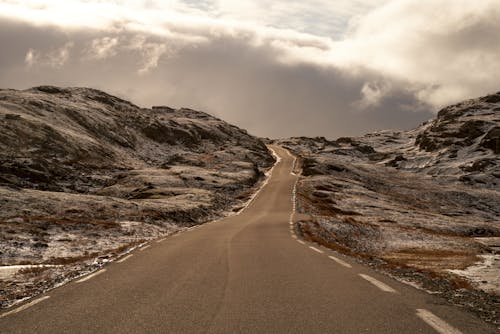 Narrow road through the Aurland highland in Norway during late autumn