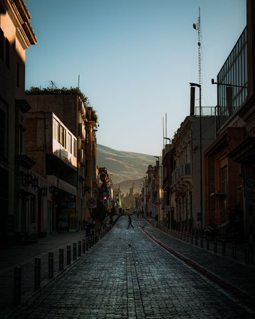 Free Beautiful city street at dawn with serene atmosphere and historic architecture. Stock Photo