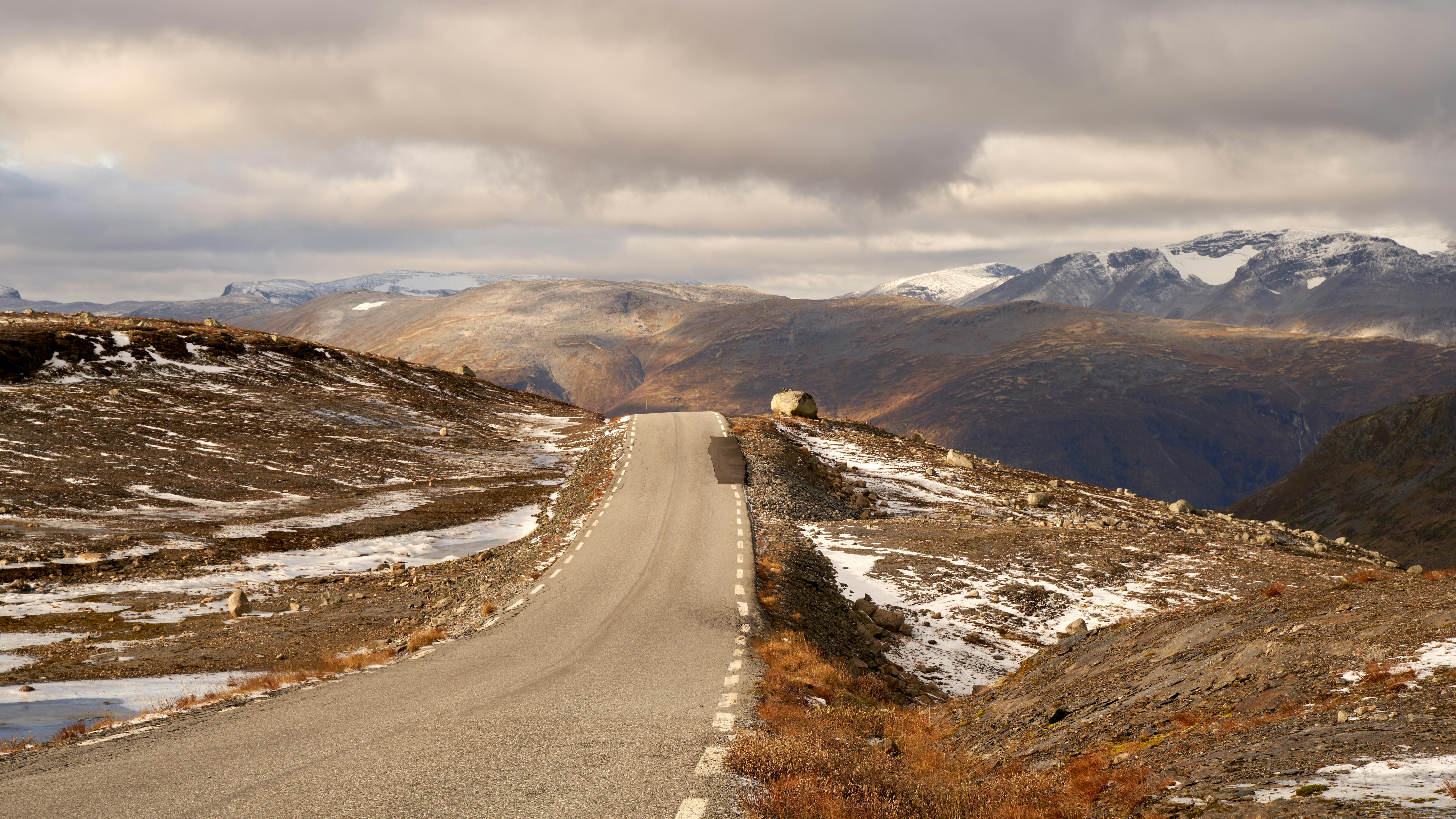 Quy Nhon to Buon Ma Thuot motorcycle route winding through a misty mountain pass
