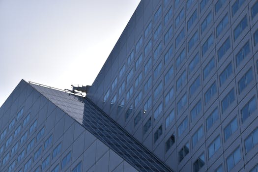 A contemporary office building with sleek glass design in Rotterdam, Netherlands.