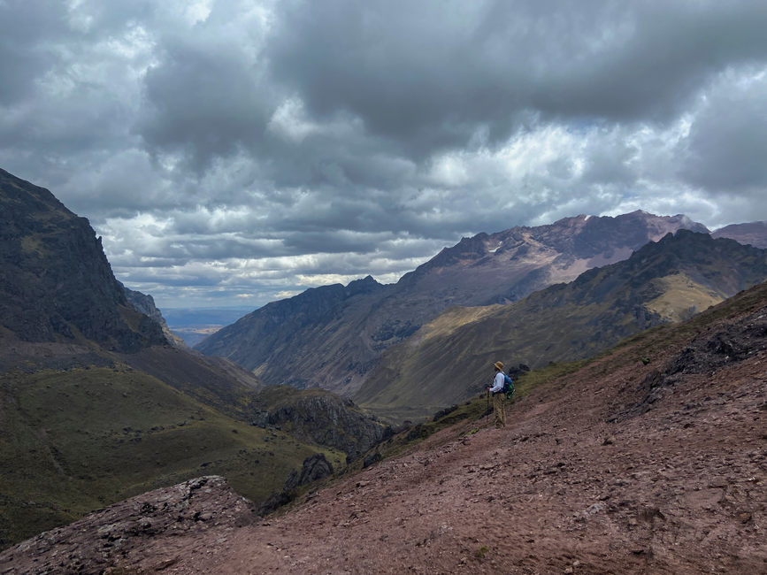 Ultimate Amazon Jungle Expedition 5 Days and 4 Nights 450 USD Review: The Ultimate Peru Adventure Review 2026 - A stunning view of a hiker in the Andes mountain valley in Cusco, Peru, with dramatic cloud formations.