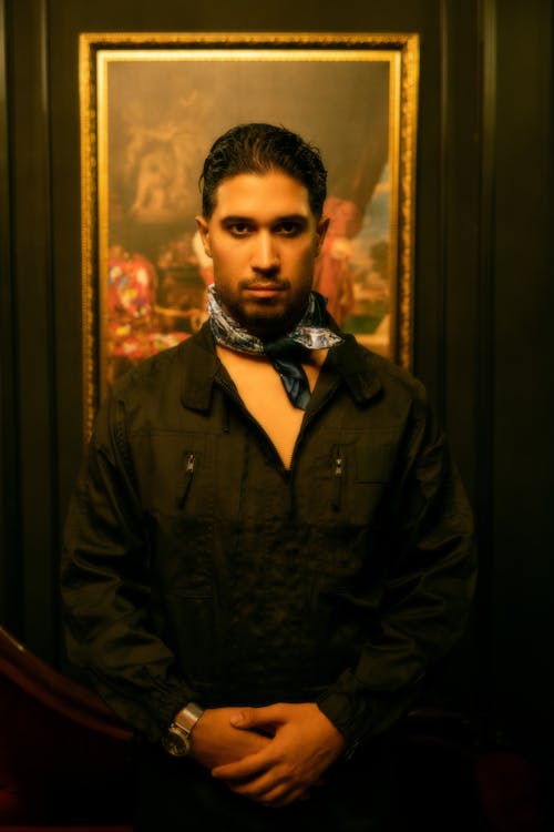 Elegant Man Standing in Front of a Painting 