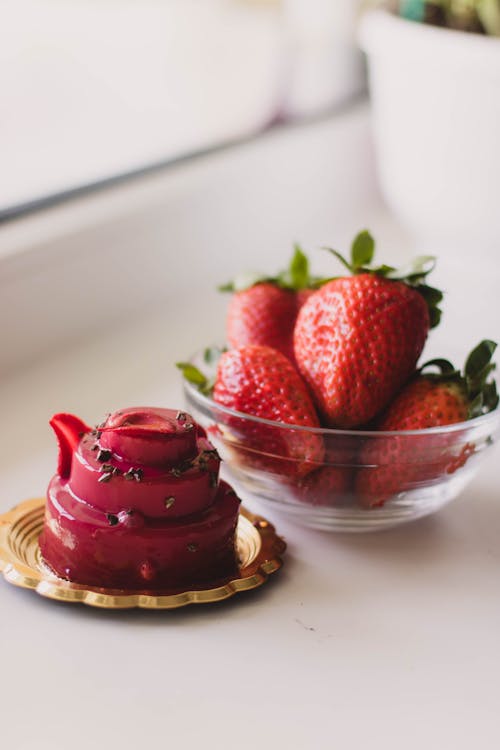 Free Plate of Cake and Bowl of Strawberries Stock Photo