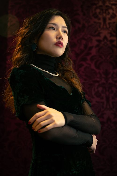 Free Sophisticated portrait of an Asian woman in elegant attire with pearls, showcasing glamour and style. Stock Photo