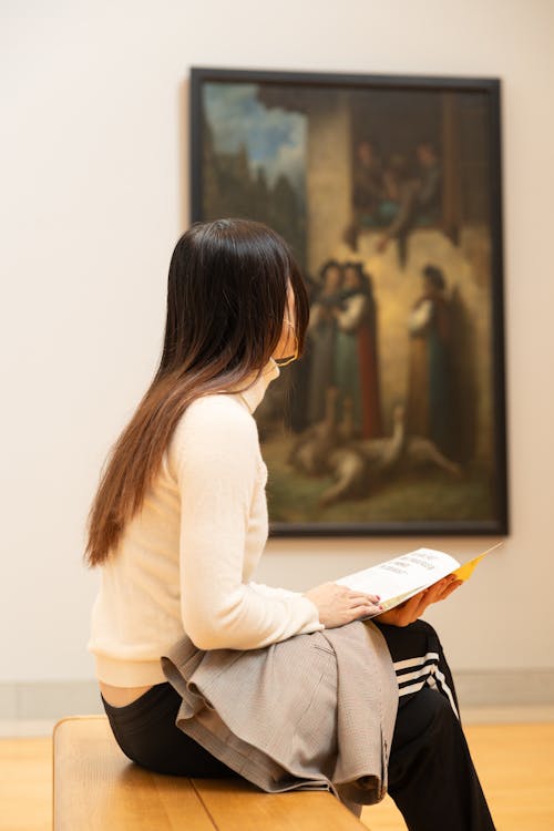 Woman Sitting in an Art Gallery