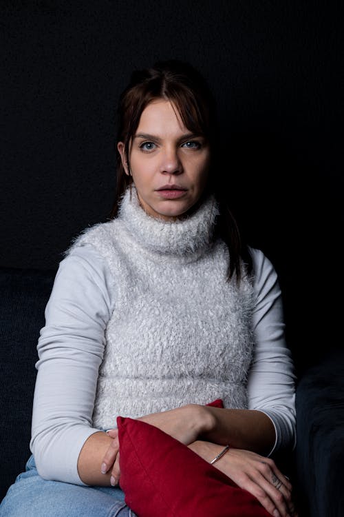 Woman in White Sweater Vest