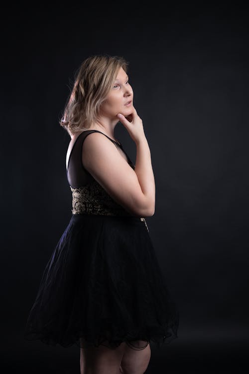 Blonde Woman Posing in Black Dress 