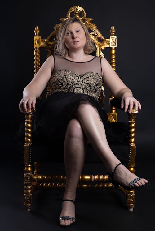 Blonde Woman Sitting on Throne