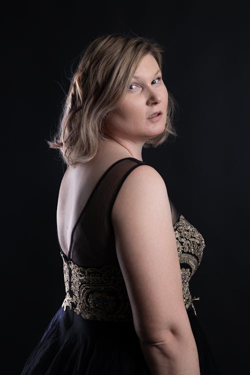 Studio Shot of a Young Woman Wearing an Elegant Dress