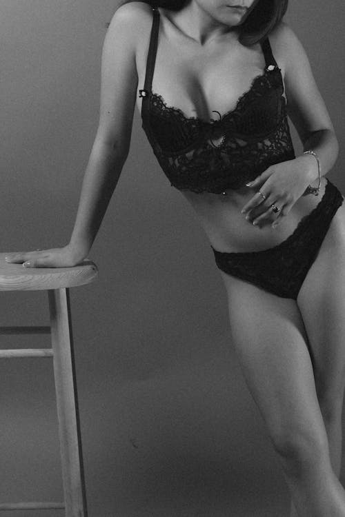 Woman Posing in Lingerie in Black and White 