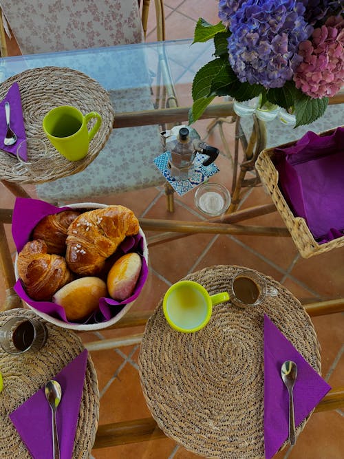 Top View of a Table with Sweet Pastry and a Coffee Pot at Breakfast 