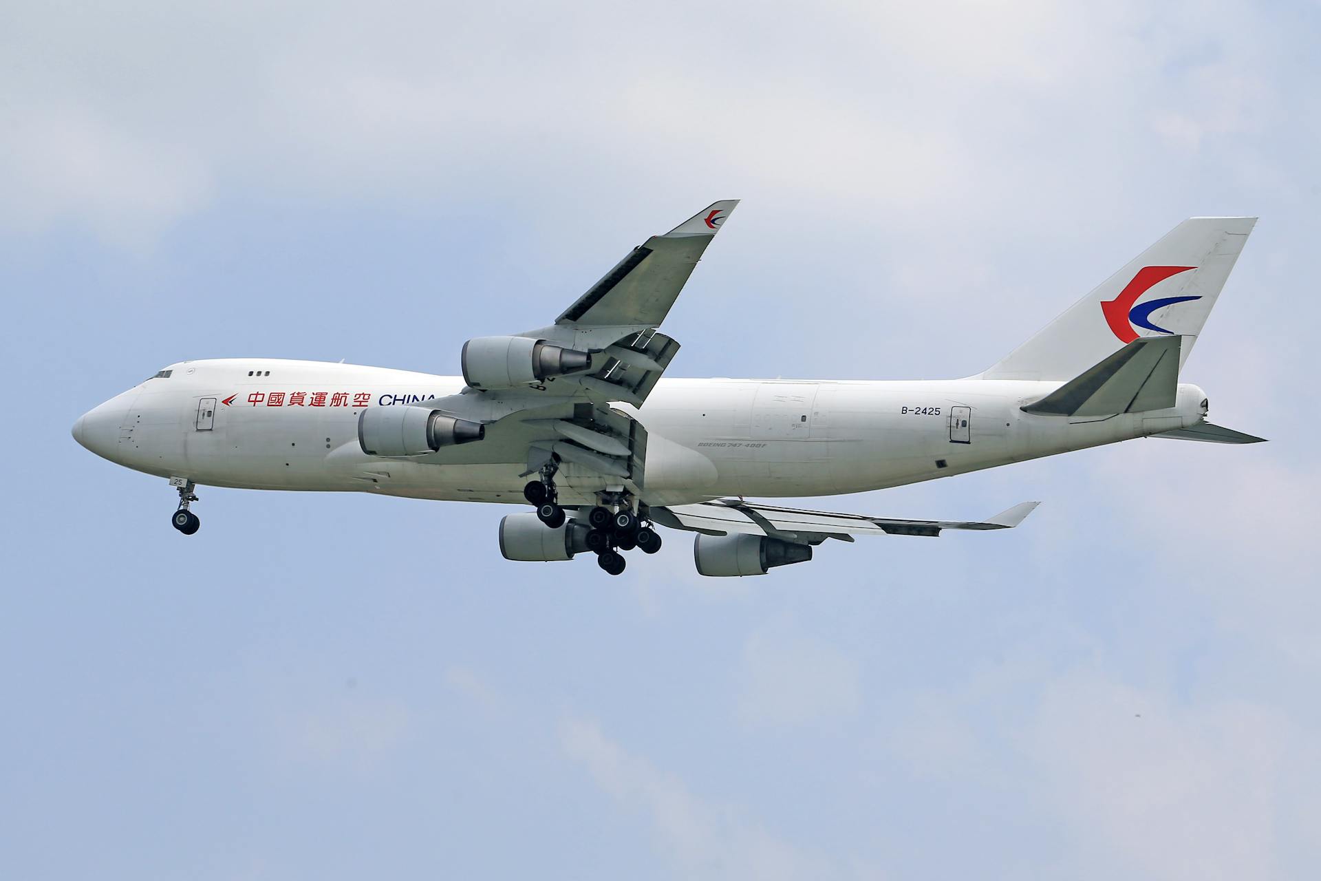 China Cargo Airlines Boeing 747 flying during daytime, showcasing transportation and aviation.