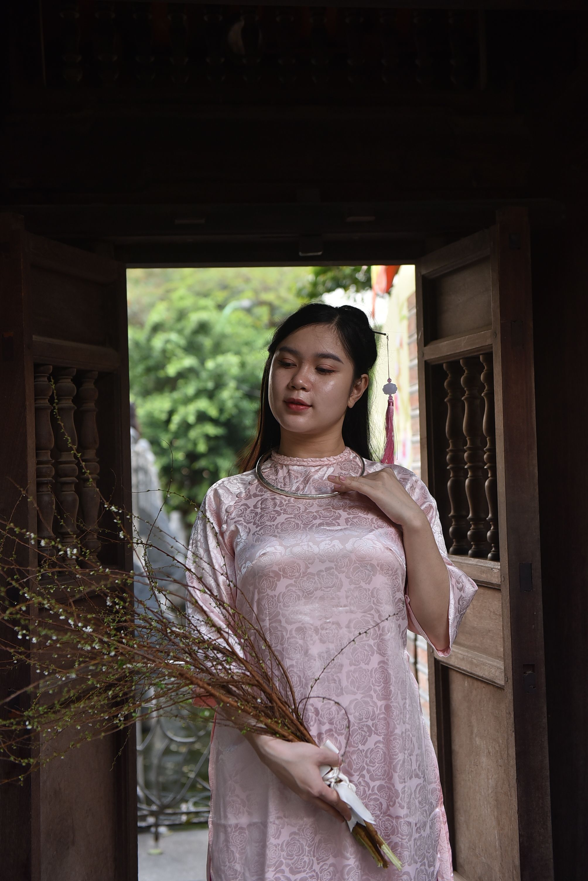 Portrait of a Young Woman Wearing a Pink Dress Standing in Front of a ...