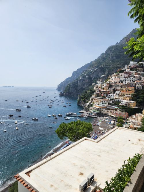 Free Stunning view of Positano's colorful village by the Mediterranean Sea, capturing its iconic beauty and summer vibe. Stock Photo
