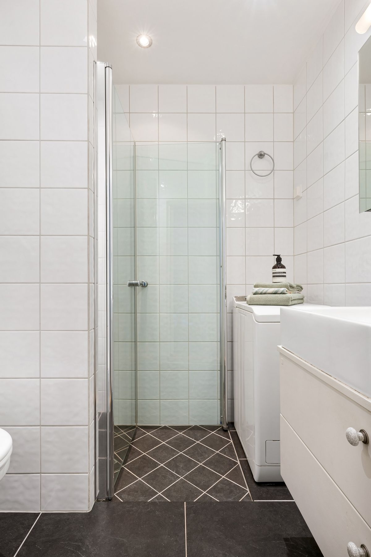 Bathroom renovation reference: compact white bathroom renovation in a Melbourne home (stock placeholder)