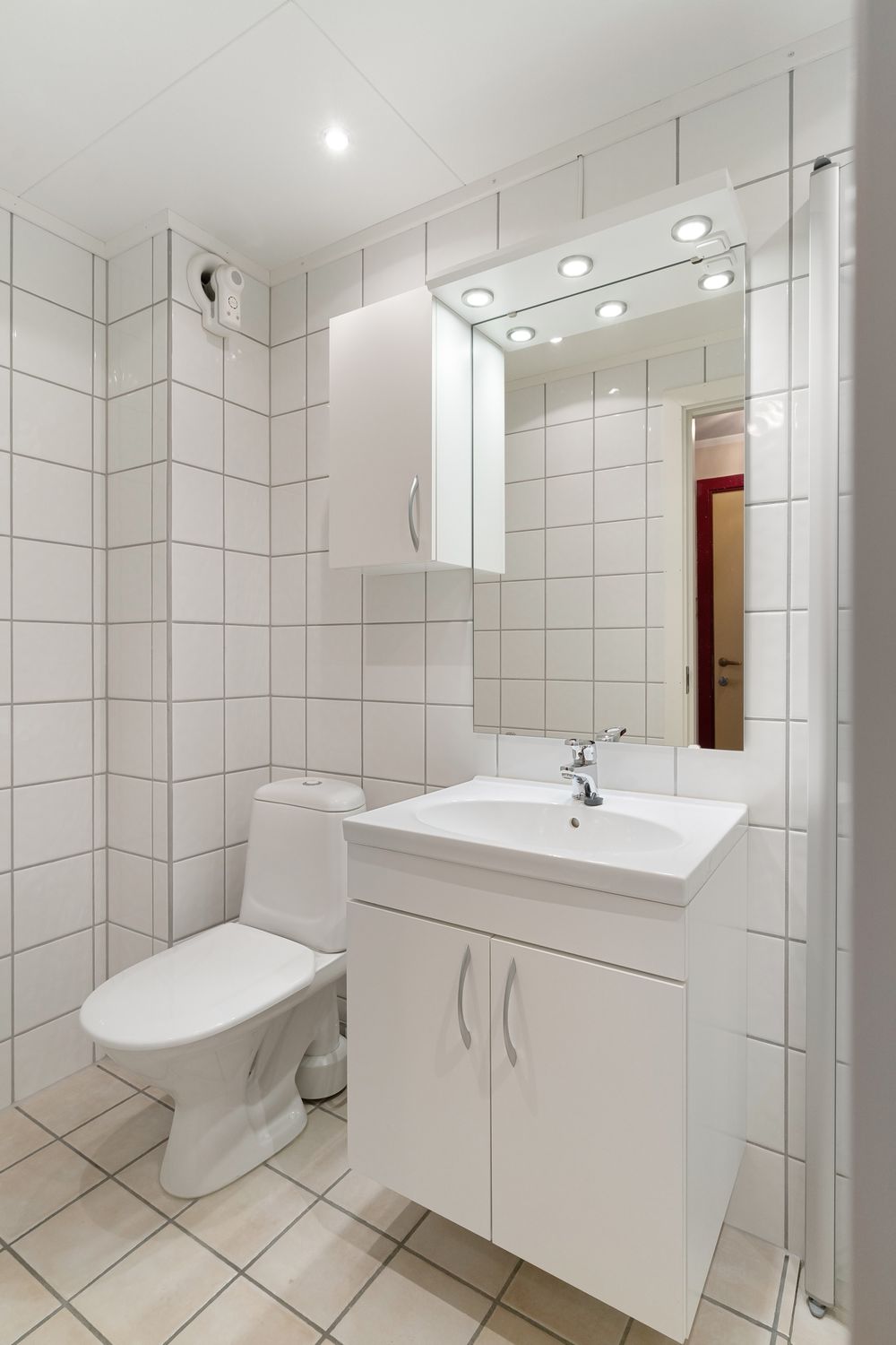 Modern bathroom interior with durable tiles and contemporary vanity