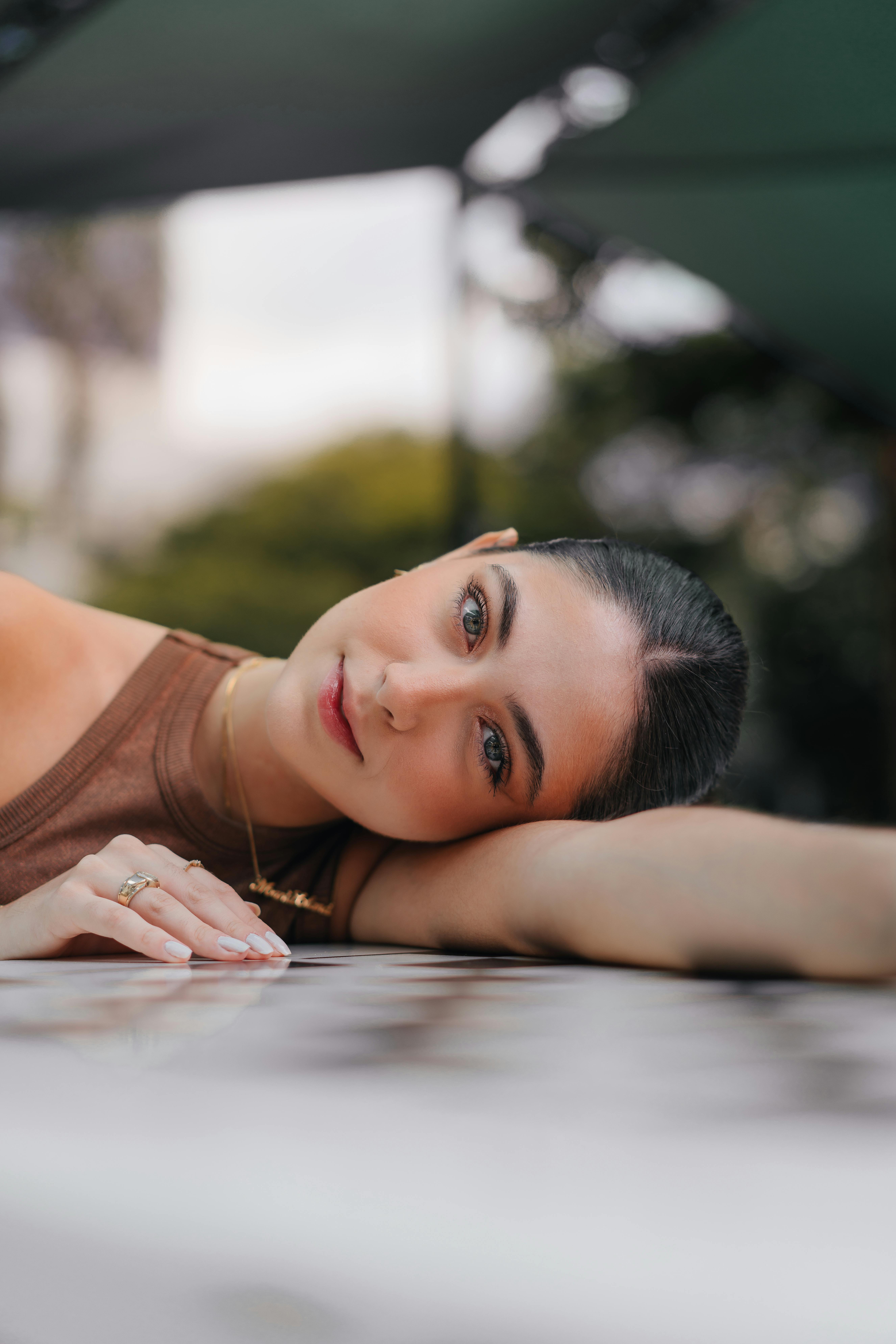 Close-up portrait of a woman relaxing outdoors in Maringá, Brazil.