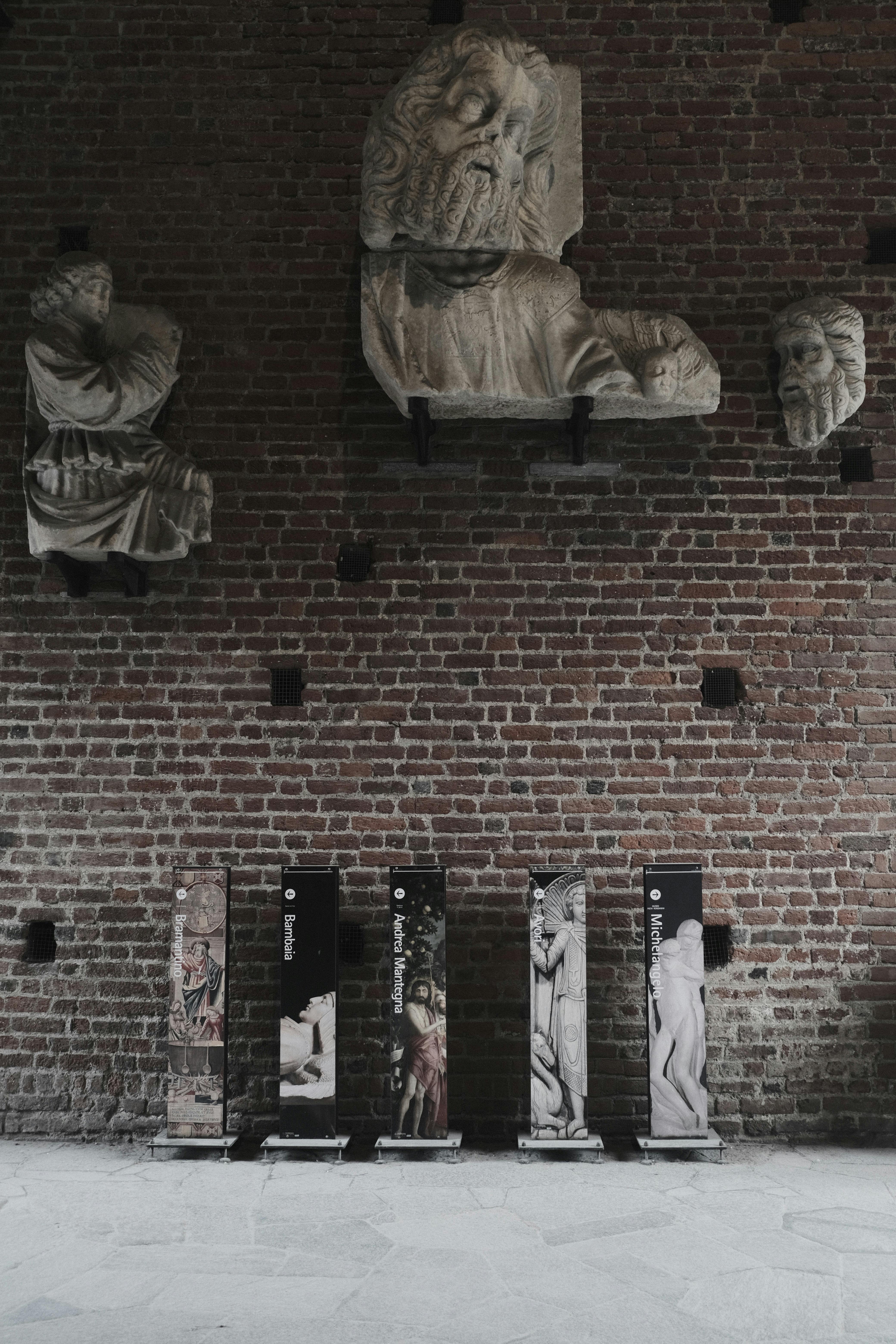 A wide shot of a gallery showcasing various chopstick art pieces, including sculptures and wall hangings.