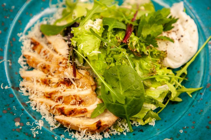 buffalo chicken in lettuce wraps with blue cheese crumbles