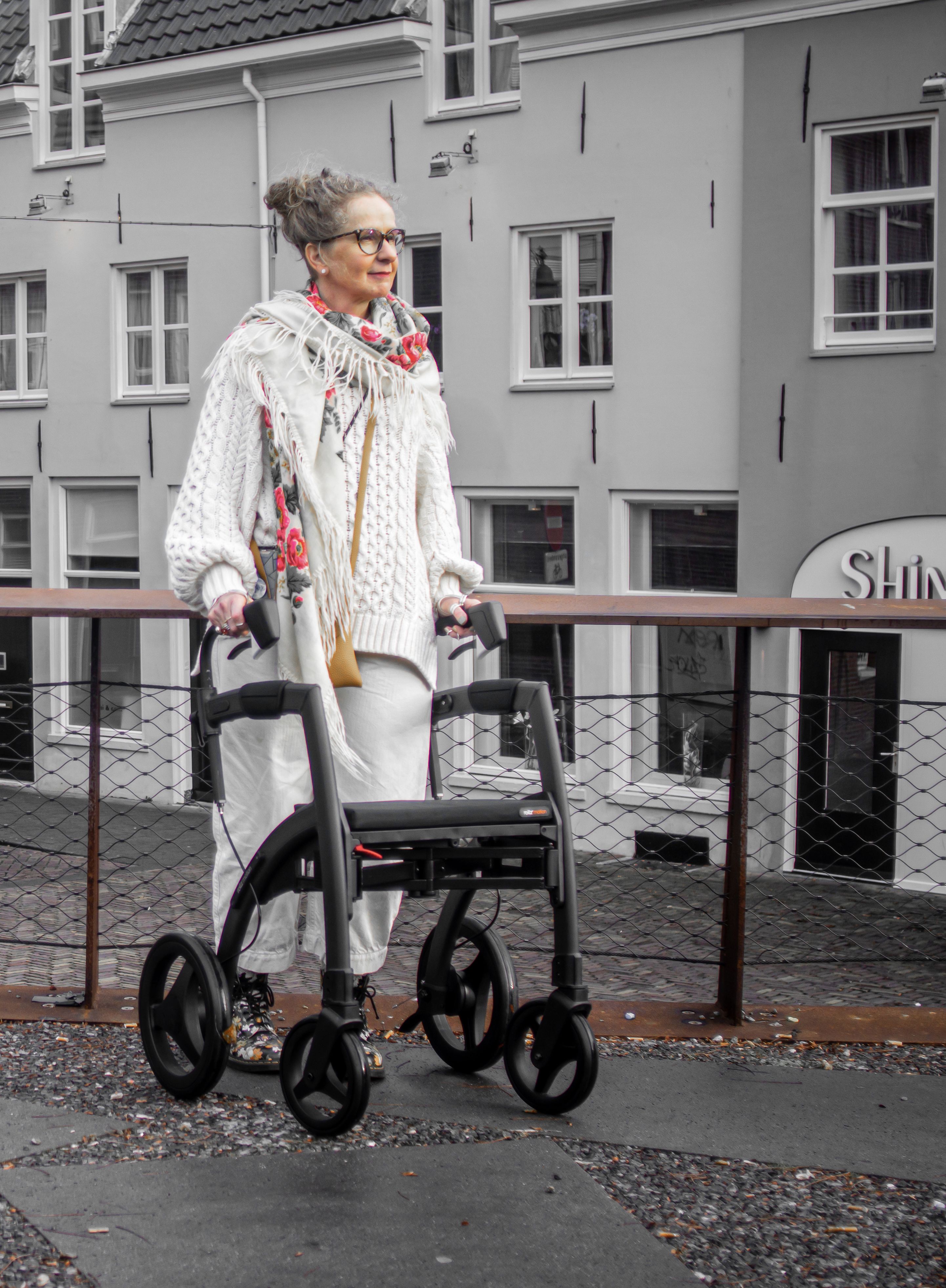 Stylish elderly woman with walker in 's-Hertogenbosch, Netherlands.