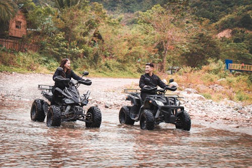 Two People on Quad Bikes 