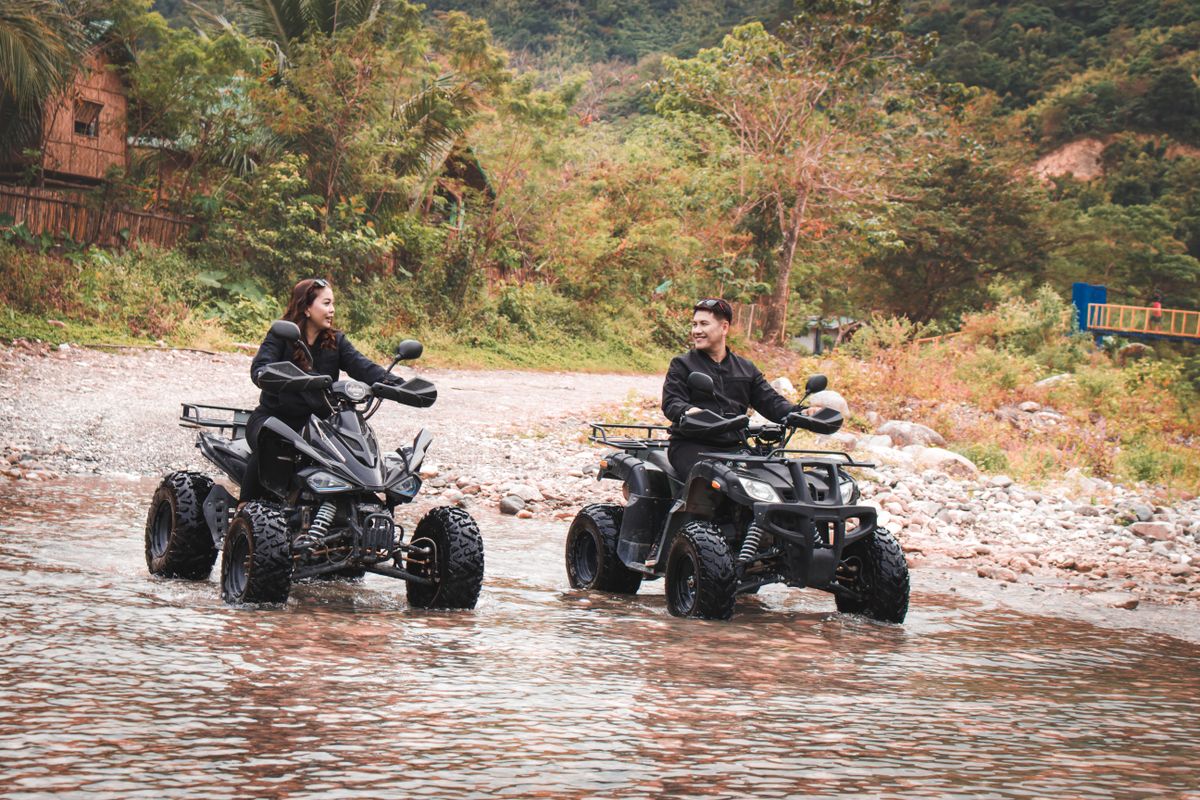 Two people enjoying a quad biking ATV adventure