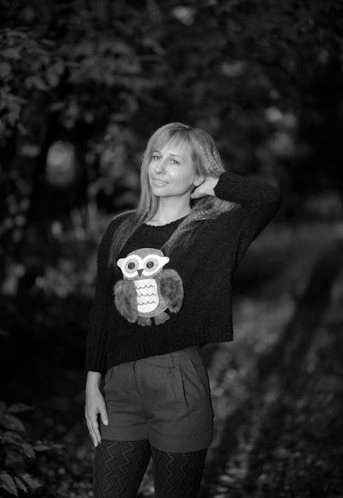 Smiling Woman in Sweater with Owl in Black and White