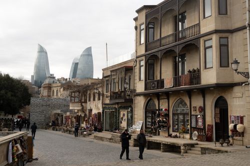 Free Explore Baku's historic Old Town with a view of the iconic Flame Towers, blending tradition and modernity. Stock Photo