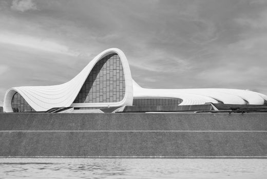 Black and white photo of the Heydar Aliyev Center in Baku, highlighting its modern architecture.