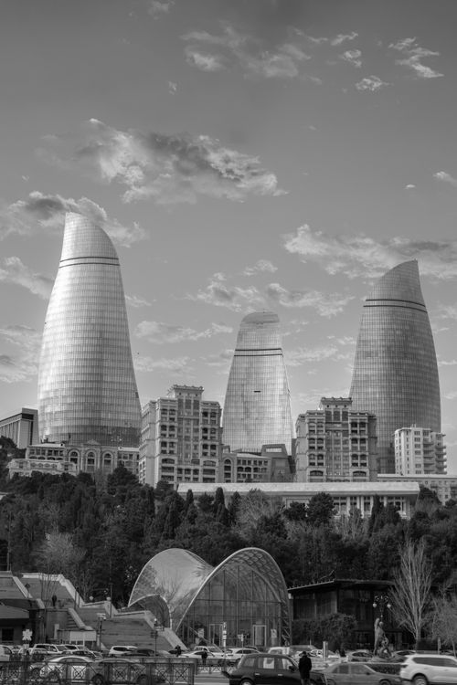 Free A stunning black and white cityscape of Baku's iconic Flame Towers, showcasing modern architecture and urban life. Stock Photo