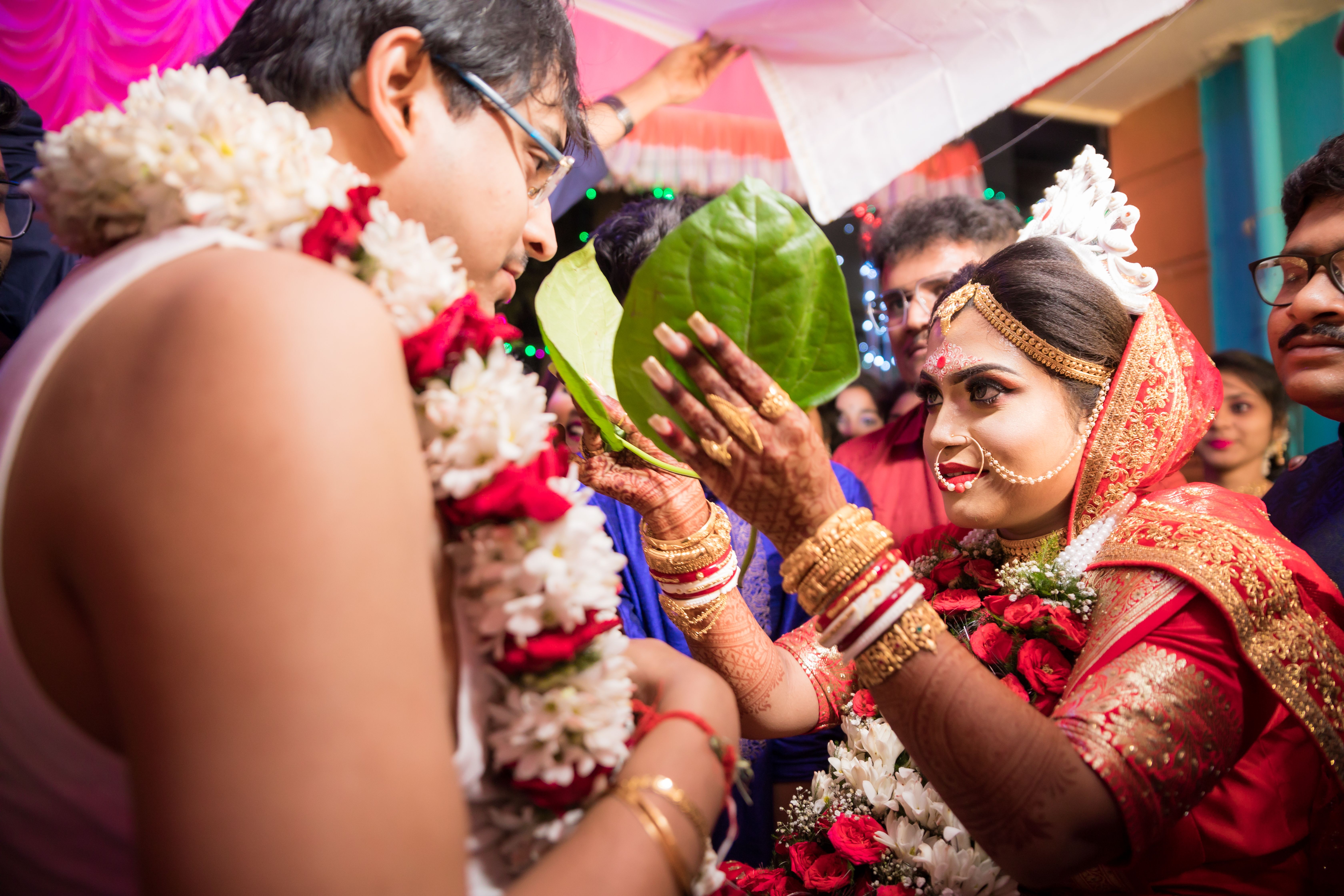 summer wedding trends egypt — Beautiful Indian wedding ceremony with traditional attire and henna tattoos.