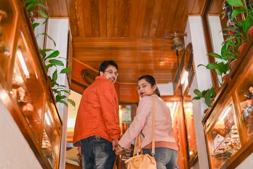 Back View of Couple Holding Hands