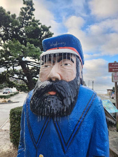 A statue of a man in a blue coat
