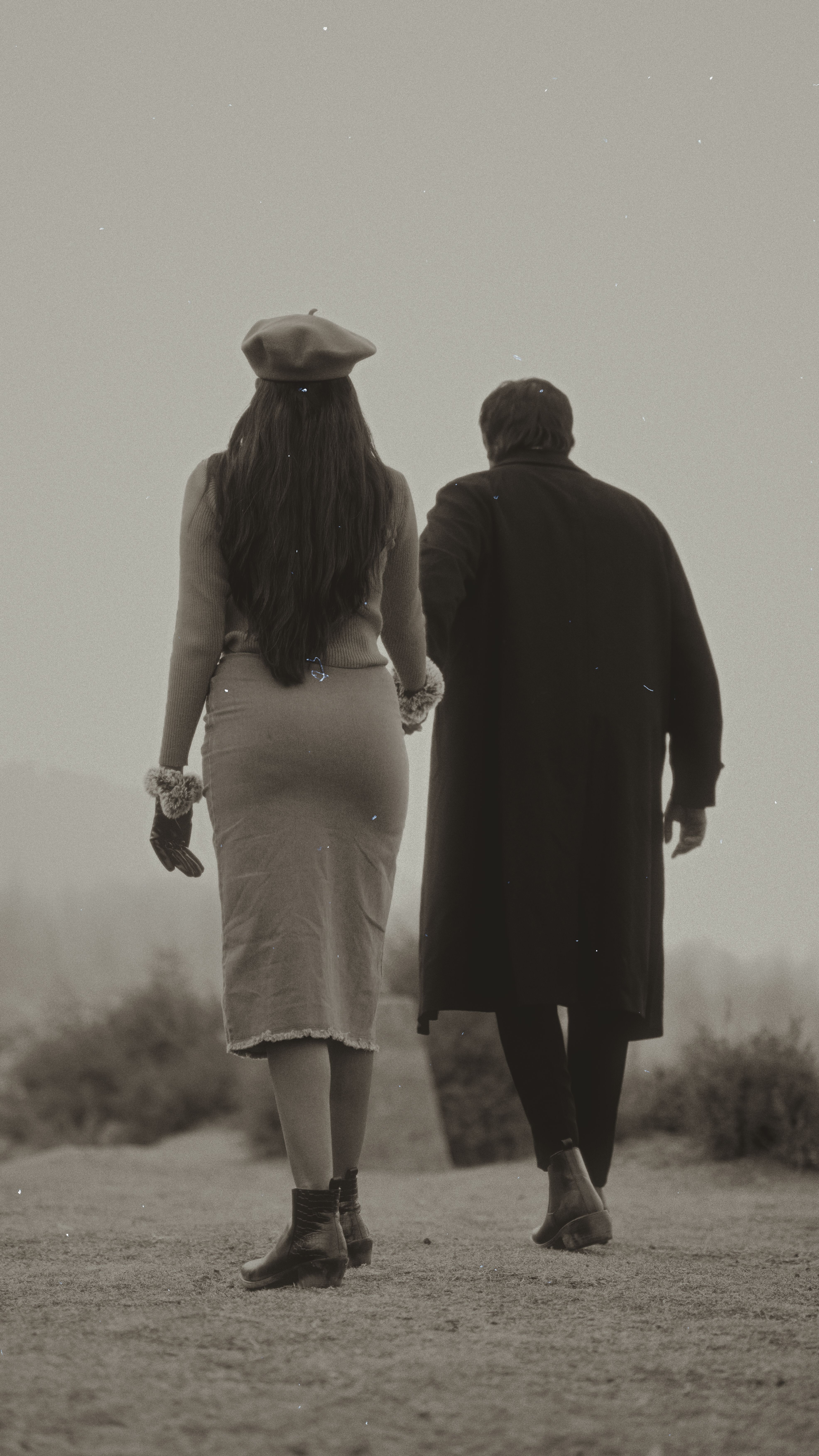 Back View of an Elegant Couple Walking Outside · Free Stock Photo