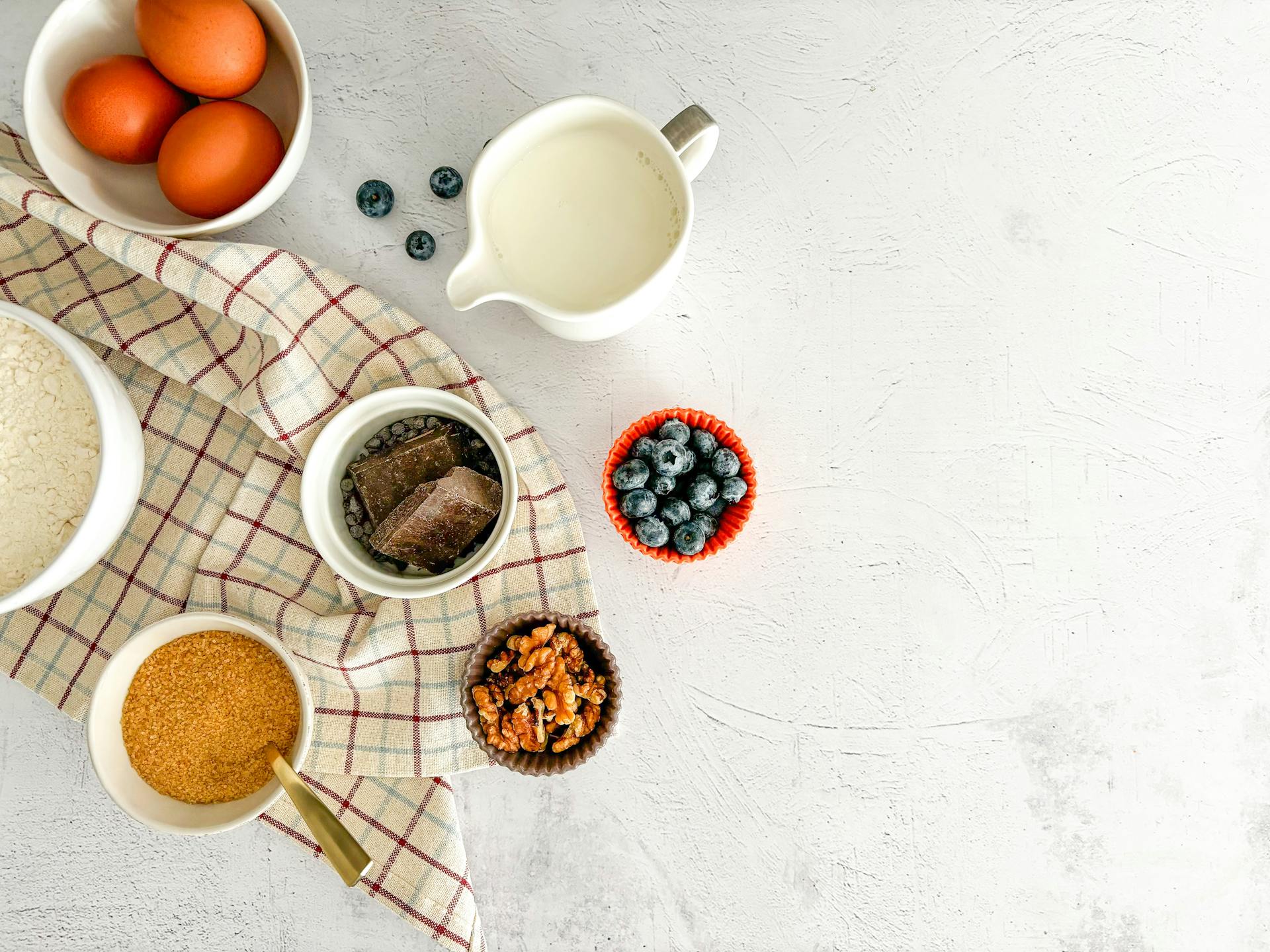 Top View of Cake Ingredients Standing on White Surface