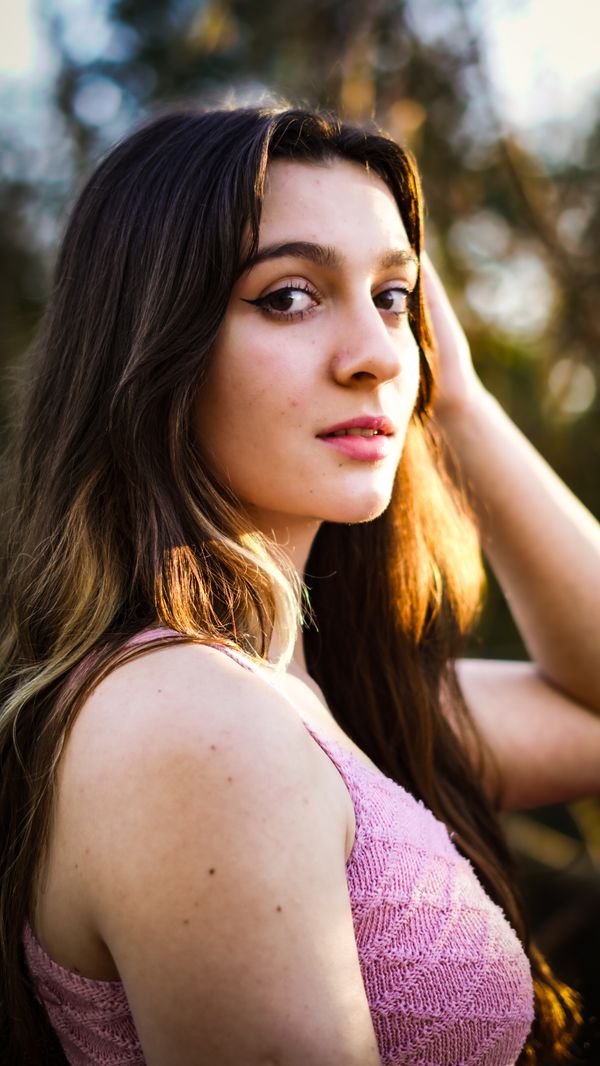 Young Woman Posing Outside in Sunlight · Free Stock Photo