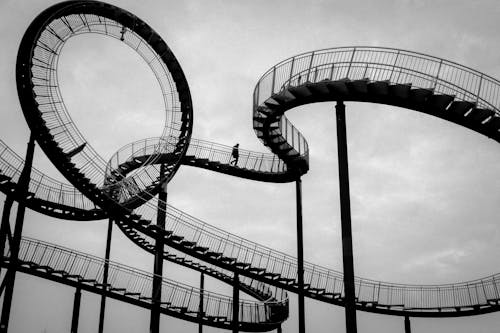 Person Walking on the Tiger and Turtle – Magic Mountain Art Installation in Duisburg, Germany
