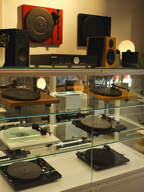 View of Turntables and Speakers on Display in a Music Store 